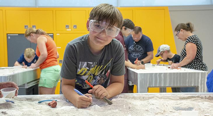 Boy at the dig experience at royal tyrrell museum