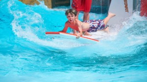 boy on surfboard adg waterpark