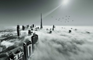 dubai skyline though the clouds from a plane
