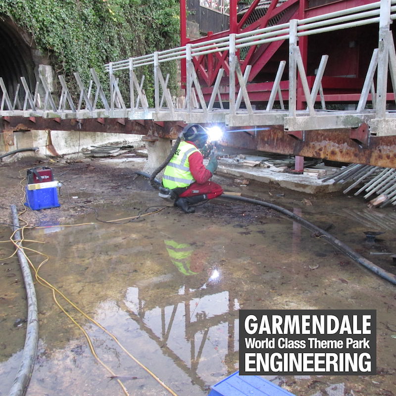 Detailed welding during the replacement of tub throughout the Dragon Falls ride