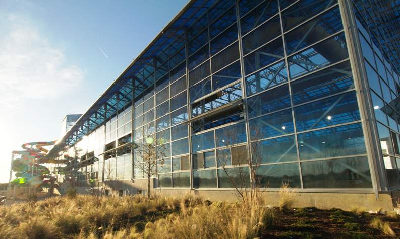 outdoor shot of epic waters indoor waterpark with OpenAire glass roof