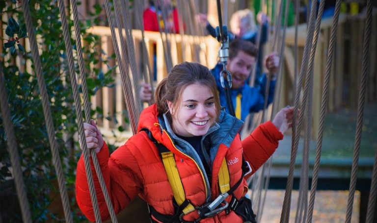 girl enjoys kanopeo aerial adventure ACCT conference