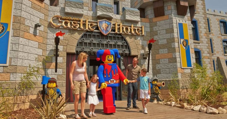 family and jester outside legoland castle hotel themed by scruffy dog