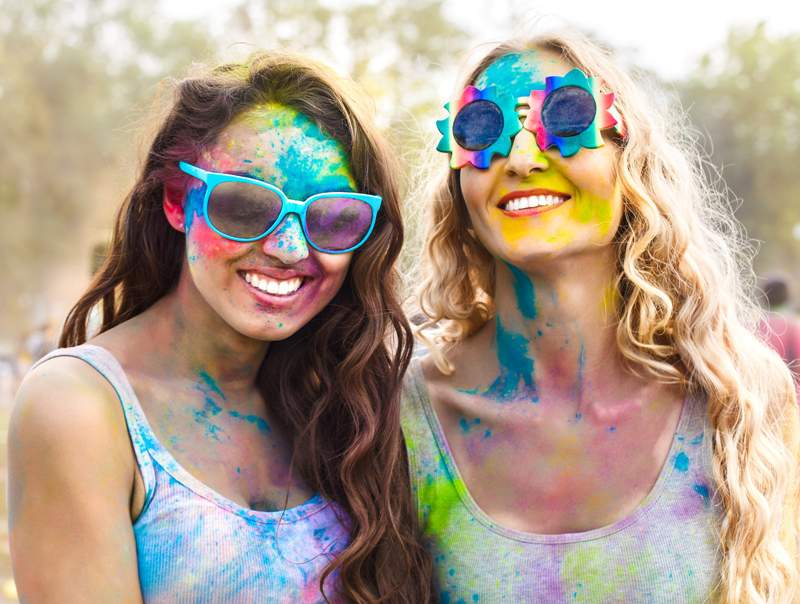 two girls in sunglasses at colour run event