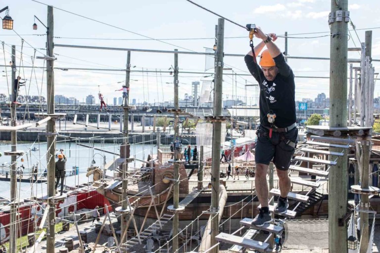 man on voiles en voiles ropes course powered by saferoller belay system by kanopeo