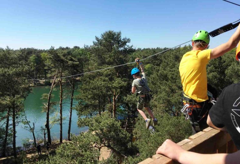 boy rides zilvermeer zipline with kanopeo saferoller belay system