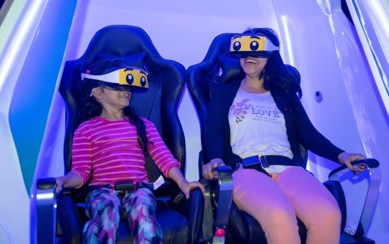 mother and child experience Immotion VR ride at Legoland Discovery Center Boston