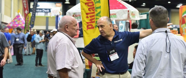 attendees chatting at world waterpark association trade show las vegas