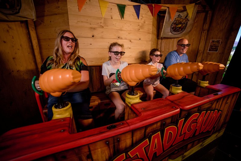 players fire carrot cannons in stadlgaudi 4D dark ride