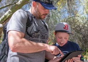 father and son use guru mobile app at Rancho Santa Ana Botanic Garden