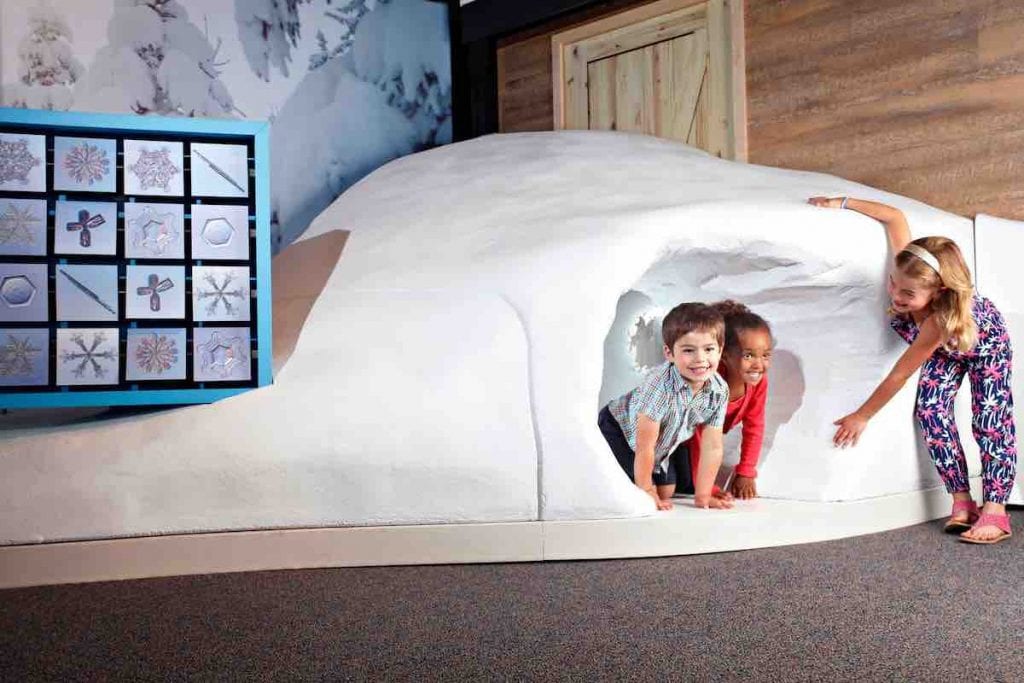 Children exploring science north wild weather exhibit