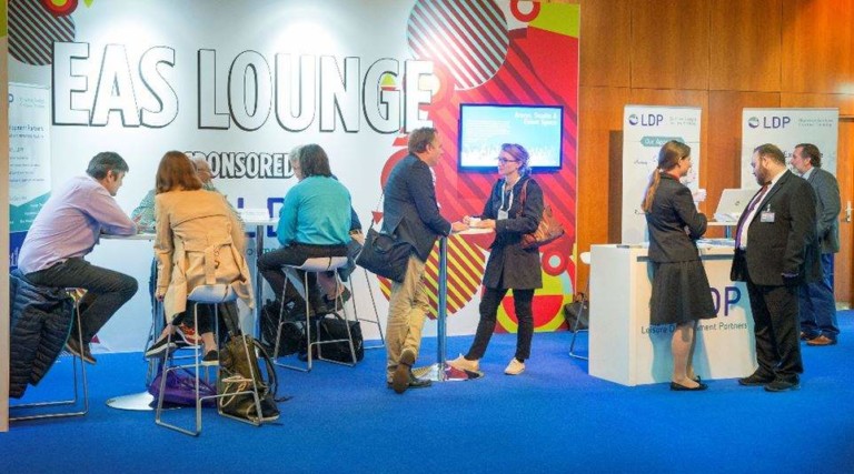 people in business lounge at euro attractions show