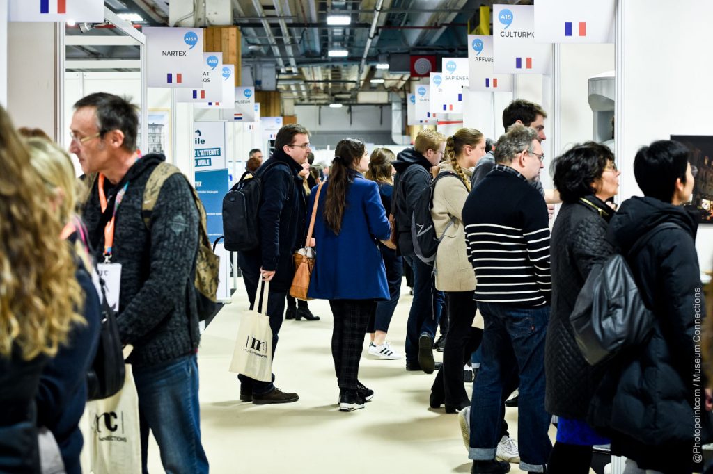 people walking around musuem connections trade floor