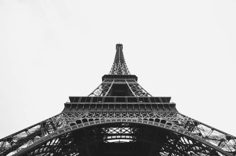 black and white shot of Paris's Eiffel Tower from below Vivaticket