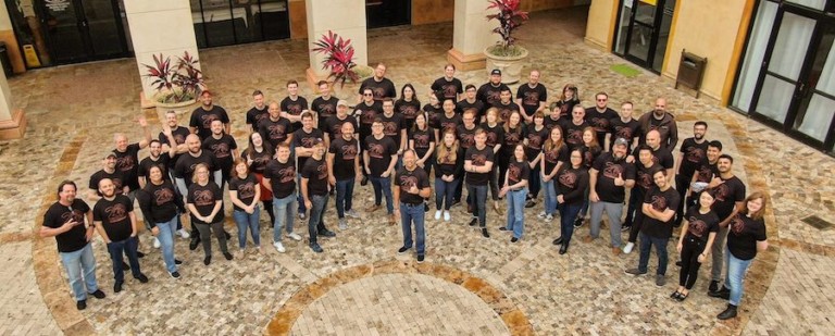 group shot of employees celebrating 20 years of Falcon's Creative Group