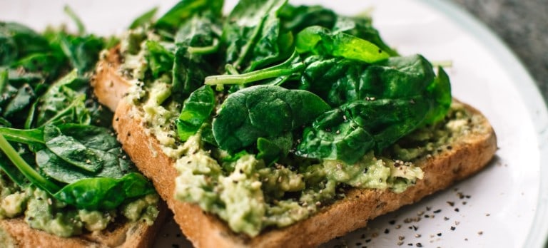 avocado and basil on toast, illustrating the vegan trends