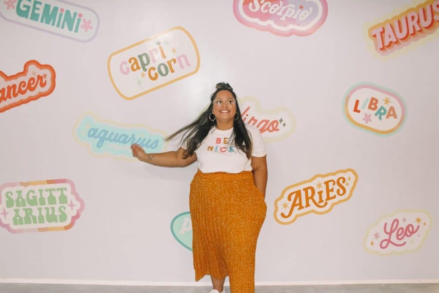 woman standing in front of star sign wall at Museum of Memories at Mall of America