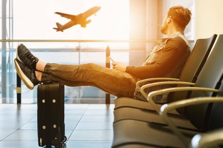 Man at airport sunset