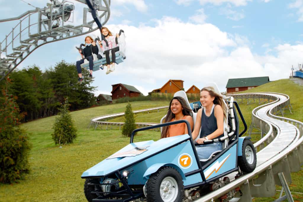 Two young women enjoy the Wiegand CoasterKart ride at Rowdy Bear Ridge Adventure Park