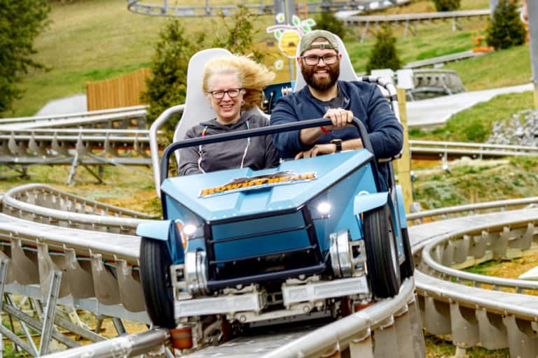 Two riders on the Wiegand CoasterKart ride at Rowdy Bear Ridge Adventure Park