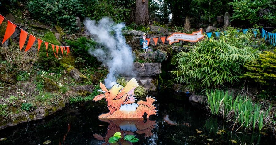 Zog statue in a pond at Warwick Castle's Zog trail from T3 Creative Agency