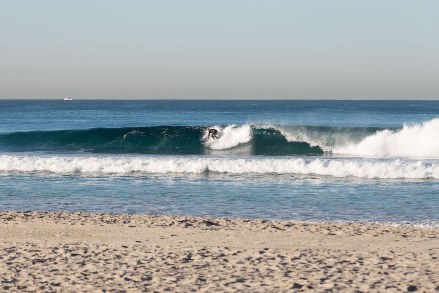 Andrew Thatcher surfing