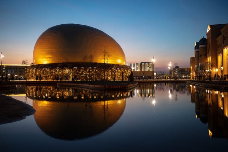 photo of golden flying theatre dome at Karavan Saray at sunset