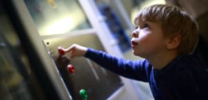 Child-in-a-science-museum-hands-on-dispaly