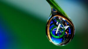 water droplet with WhiteWater ride reflected inside