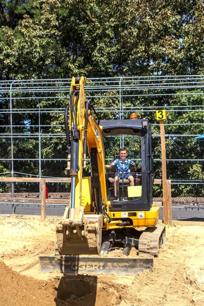 child on machinery at Diggerland