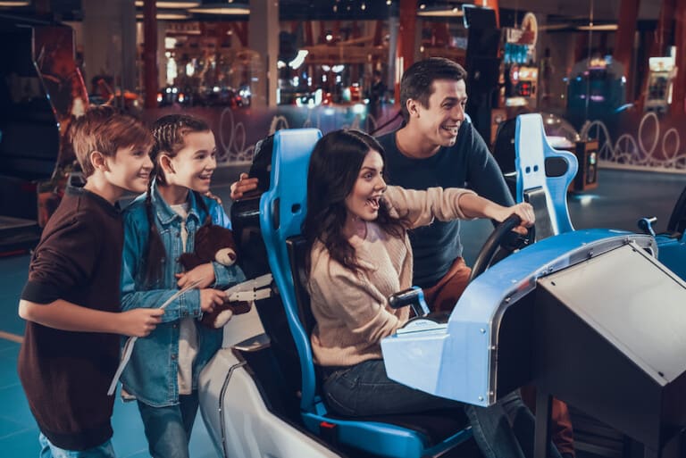 Family-at-arcade planning an entertainment centre