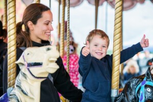 family on carousel