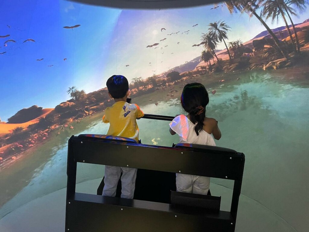 Children on the Super Reality Stand-Up Theater by Full Dome Pro, at IAAPA Asia 2023. 