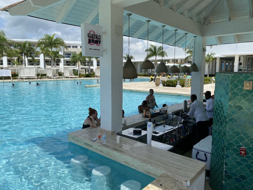 Guests enjoying the Run & Juliet swim up bar in Falcon's Resort by Melia in Punta Cana, Caribbean