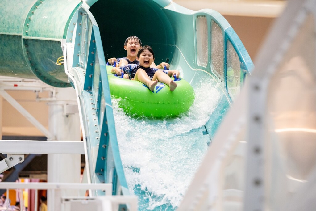 People on a tube at an Infinity Master Blaster water ride Innovation Awards 2023