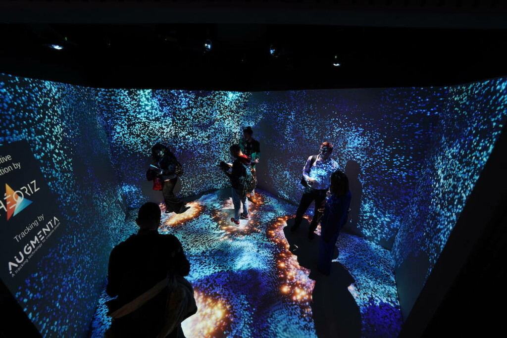 People standing in Christie immersive space at ISE