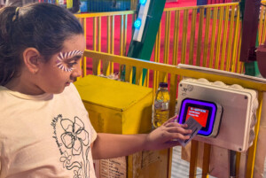 Semnox Kid tapping RFID card to access ride