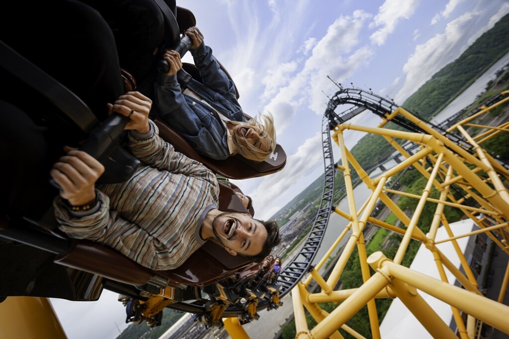 Riders enjoying a thrilling ride on a Hyper Coaster